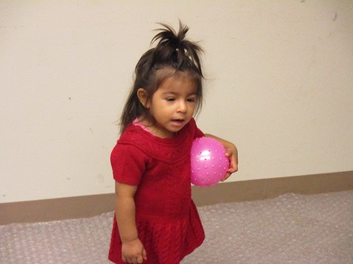 This little girl has a ball